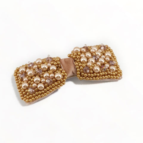 Buy the best luxury, designer childrens hair bow.  This kids hair clip is custom made with gold pearl beads and crystals, set on a blush velvet bow.