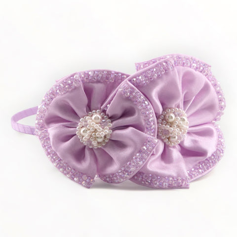 Best designer girls headband in lilac.  The Angelina headband is created with purple satin hand stitched flowers that are enrusted with crystals and pearls.  Perfect for childrens special occasions by Sienna Likes to Party, best luxury hair bands for children