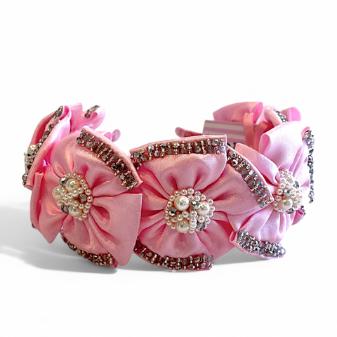 Buy best girls designer pink flower headband.  This hair accessory is hand stitched with metalic silver crystals and a centre of pink pearls and crystals.  Perfect flower girl, bridal or special occasion childrens hair accessory by Sienna Likes to Party