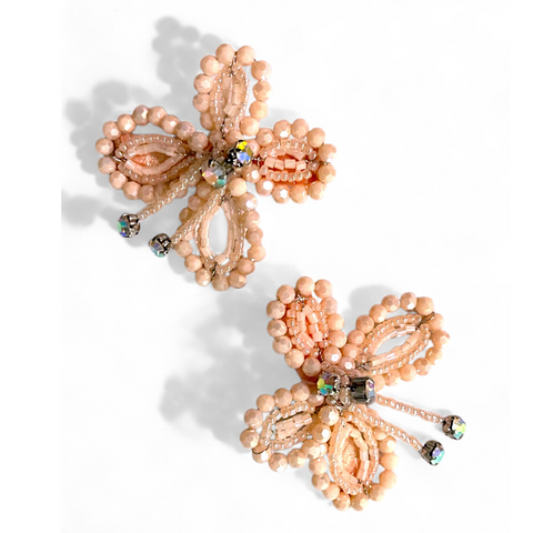 Buy the best luxury handmade toddler hair accessories.  Each butterfly in this hair clip set is handcrafted with pastel apricot cut crystals and rainbow rhinestones.  Designed by Sienna Likes to Party