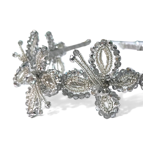 Buy Luxury girls Hair Accessories.  This metalic Silver butterfly childs headband is entirely handmade with cut crystals.  Perfect sparkling special occasionwear accessory for princesses.