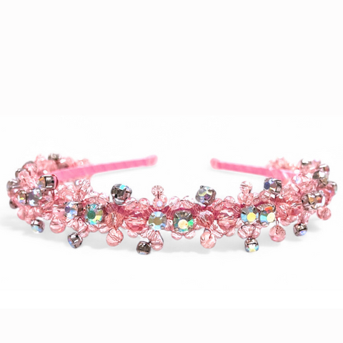 Discover this entirely handmade luxury, and bespoke headband for kids.  It is hand stitched with pink crystals and further embelished with rainbow rhinestones for extra sparkle, perfect for flower girls, weddings and childrens special occasionwear