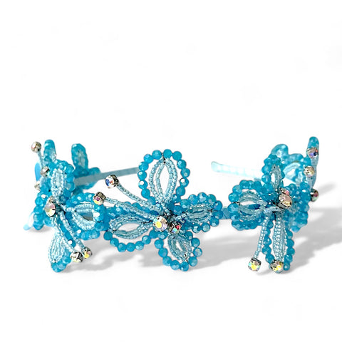 Buy the best bespoke turquoise blue headband for kids by Sienna Likes to Party.  This headband is uniquely handcrafted with turquoise blue cut crystals and rainbow rhinestones.