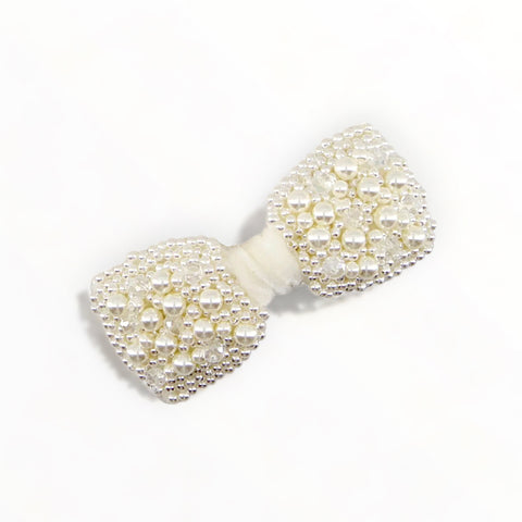 From a collection of the best Luxury Designer pearl bow hair clips for children.  The Adelpha clip is handmade with pearl and crystal beads on an ivory white velvet bow.