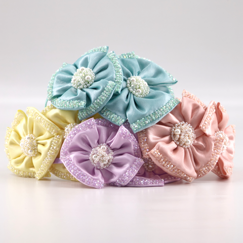 Buy the best designer pastel hair accessories for children by Sienna Likes to Party.  Each piece is uniquely handmade with hand stitched crystals and pearls.  The perfect flower girl or bridal accessory.