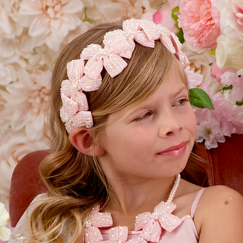 Girls Luxury Hair Bow Headband for girls by Sienna Likes to Party, hand beaded with pink crystals and pearls, bespoke for special occasions.